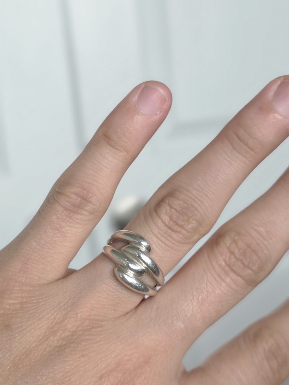 Sterling silver ring with four sweeps of metal